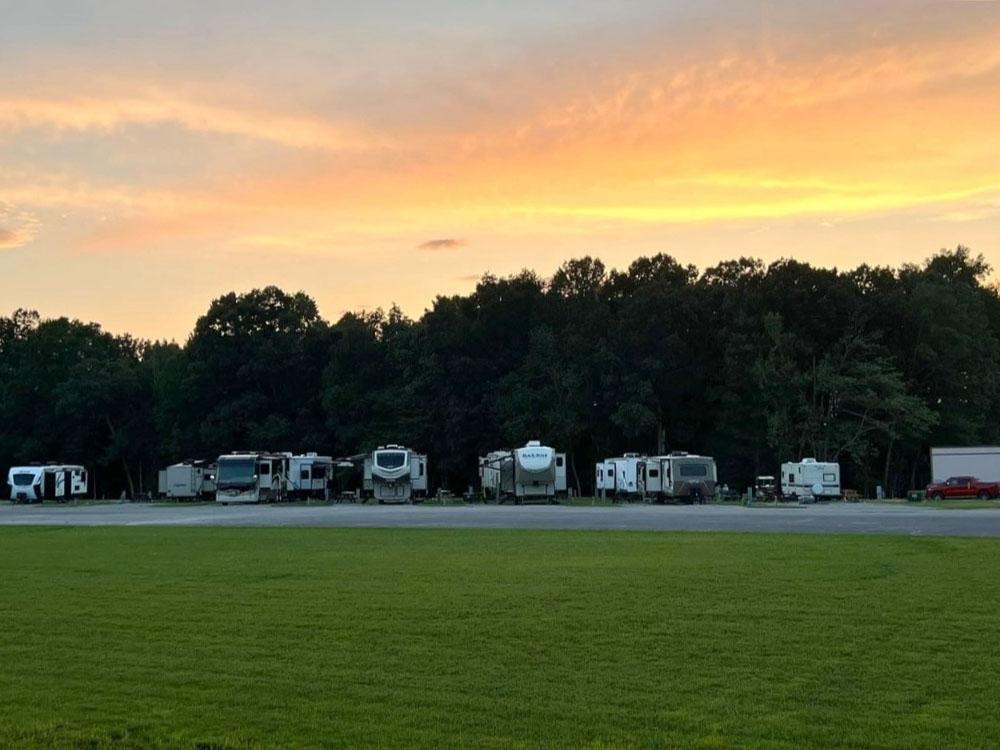 A view of RVs parked at sunset at THE LANDING STRIP CAMPGROUND