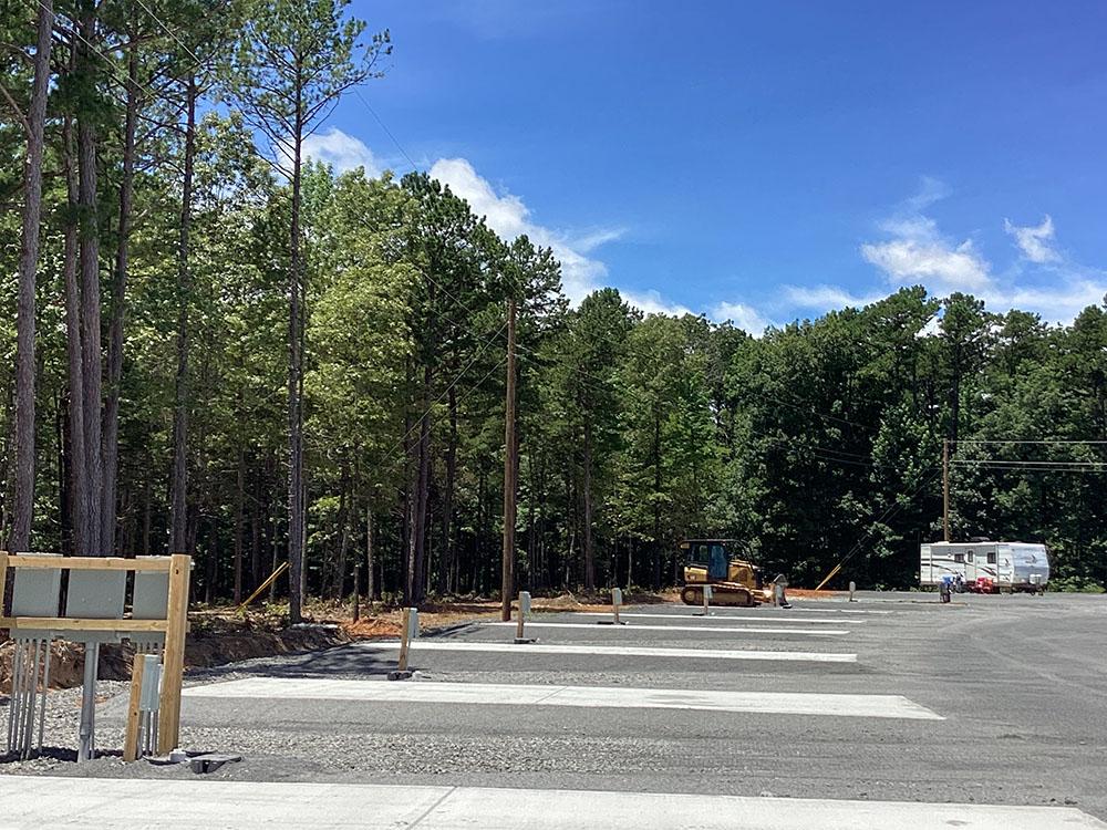 Paved sites surrounded by trees at Dew Drop In