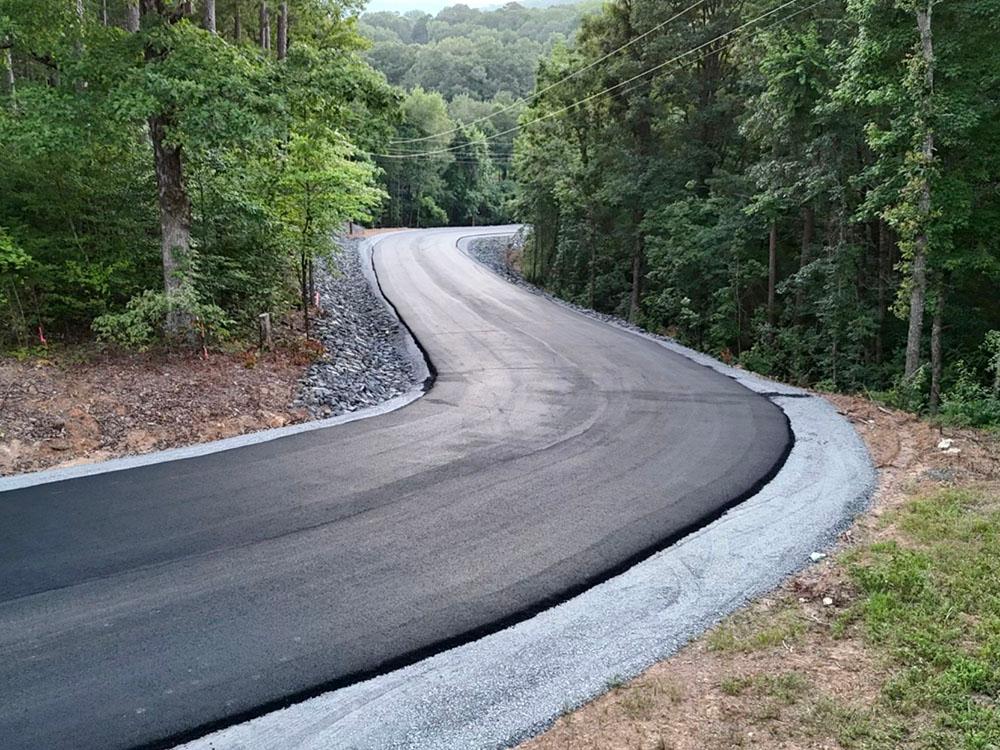 Winding paved road at DEW DROP IN