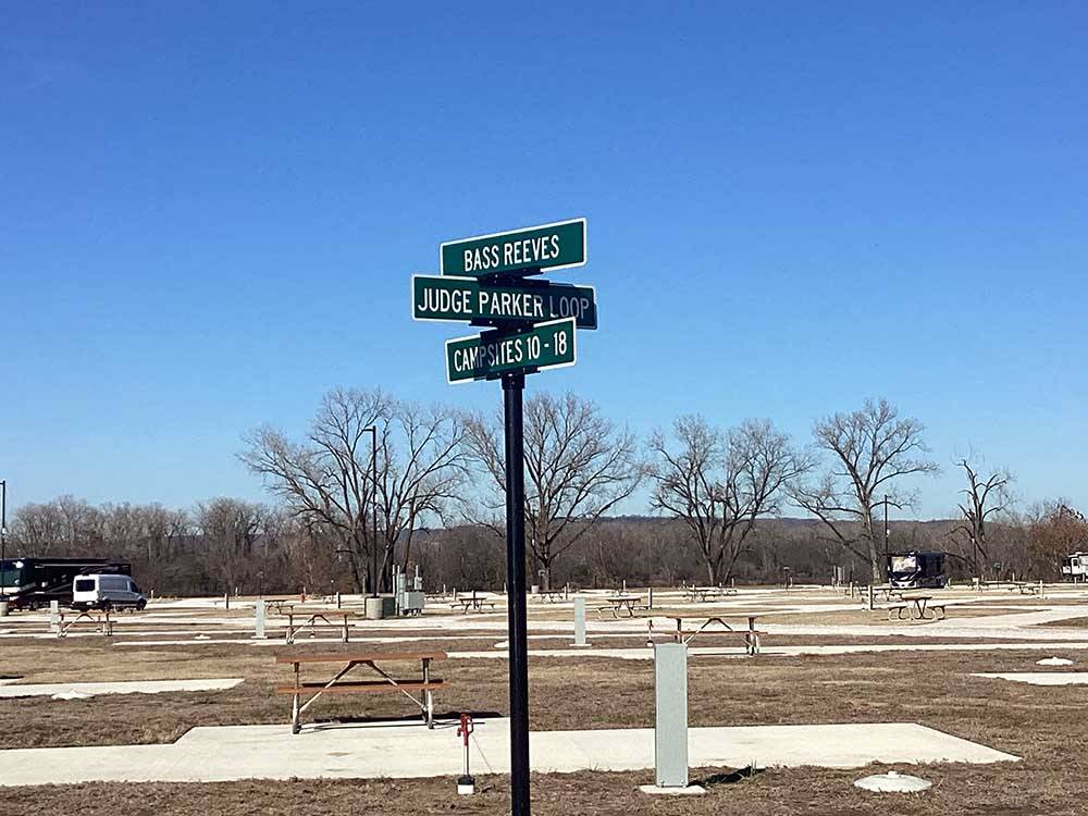 A street sign next to the RV sites at RIVERFRONT RV RESORT