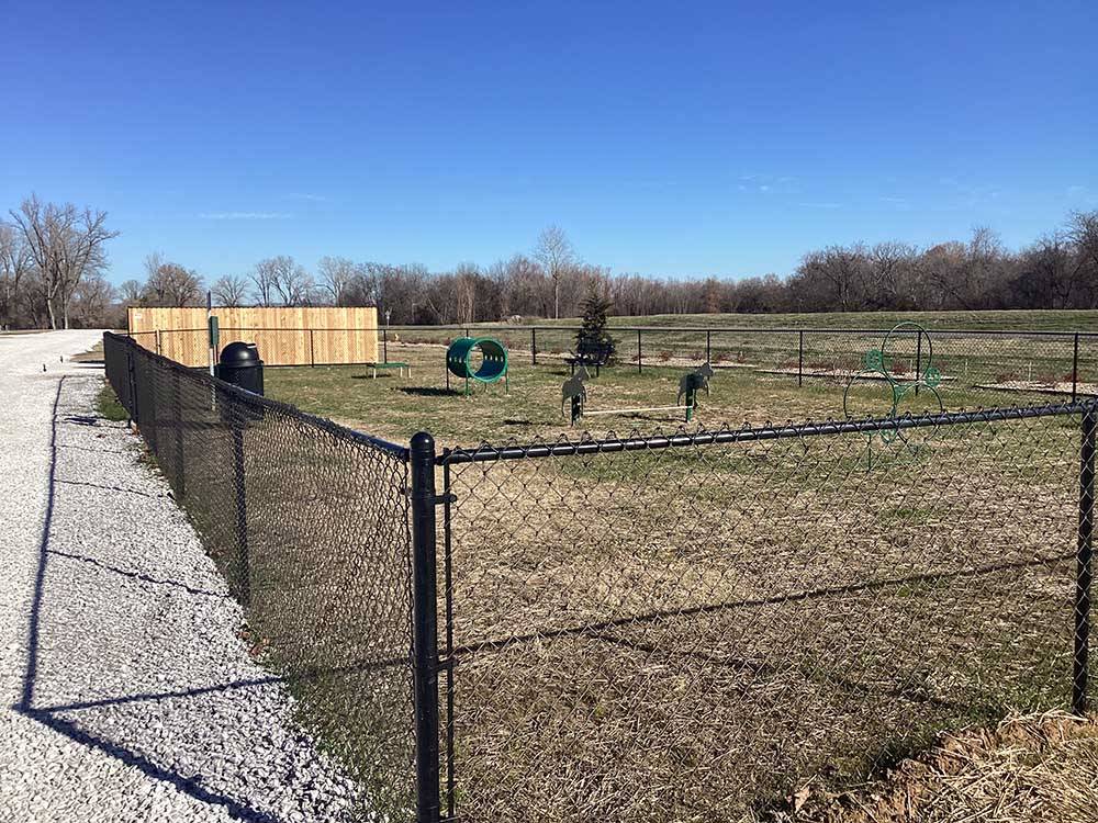 The fenced in dog area at RIVERFRONT RV RESORT