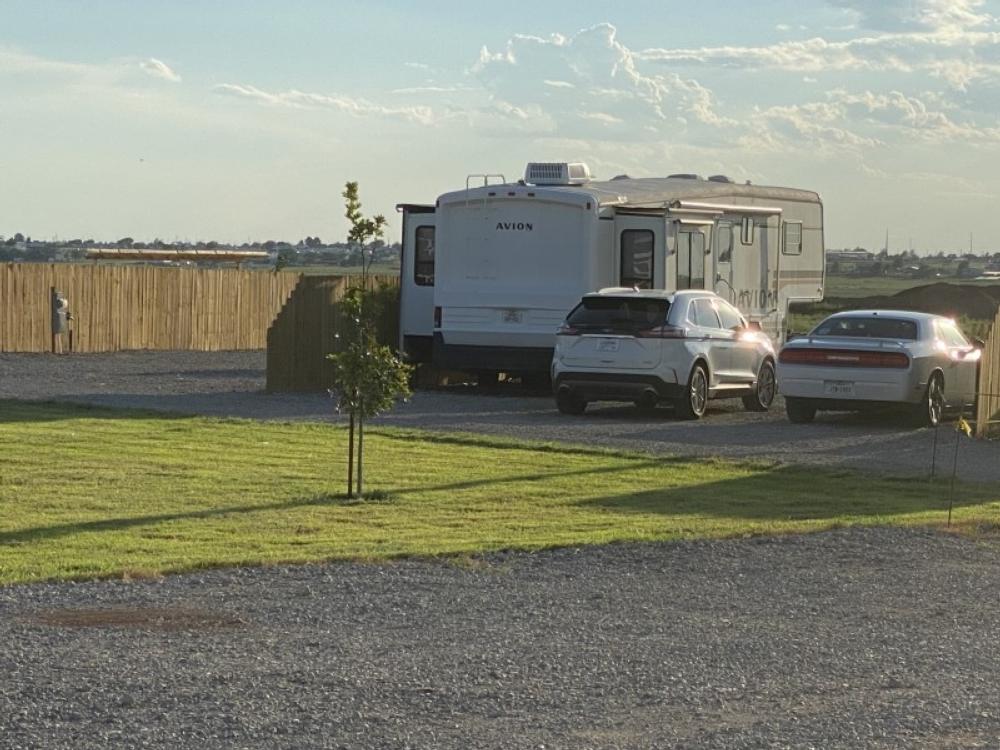 RV and cars in a gravel site at Scenic Valley RV Park