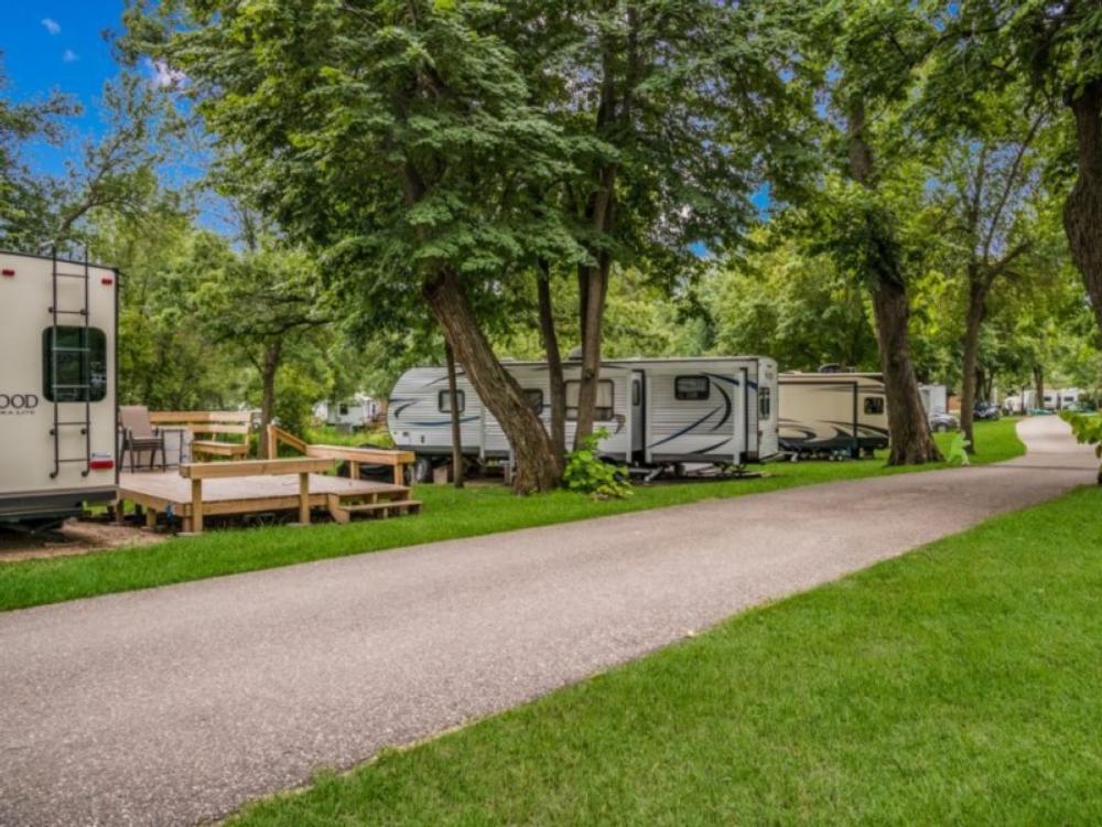 Sites by trees at Canary Beach Resort