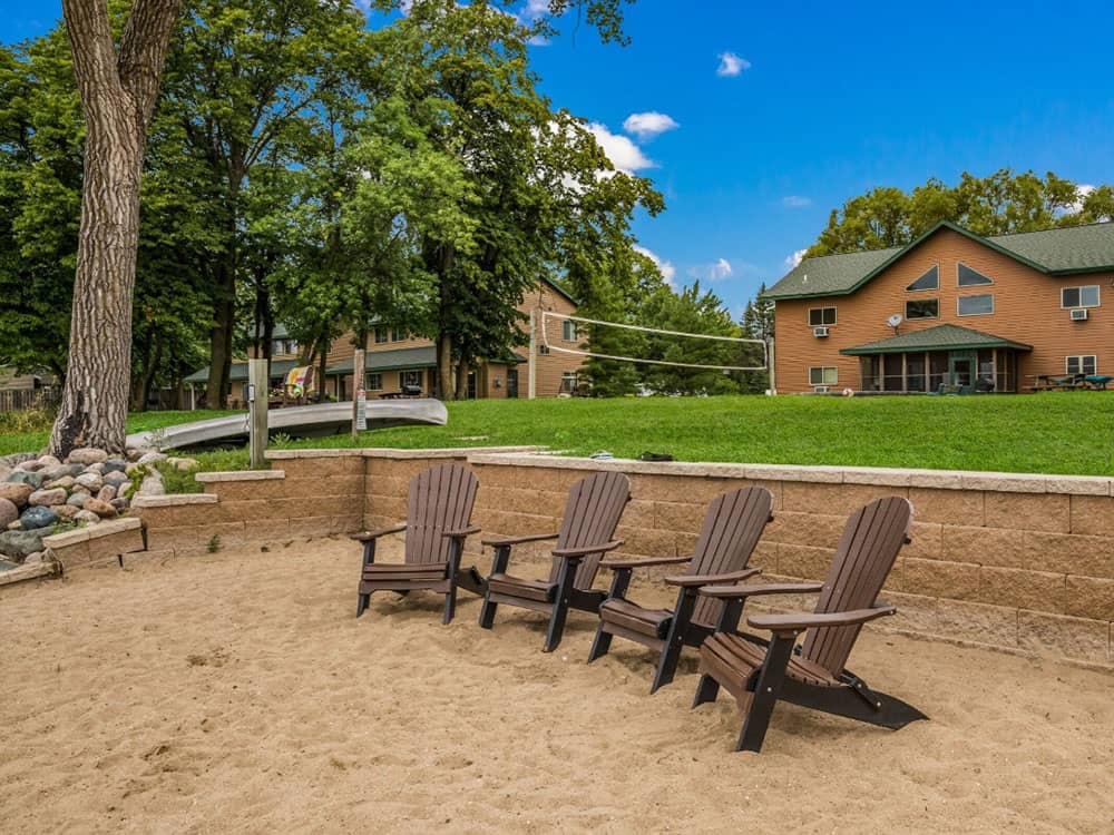 Adirondack chairs in the sand