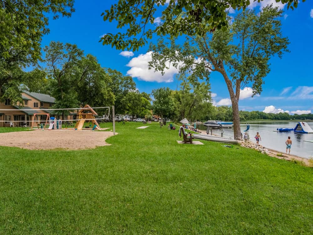 A beach volleyball net near the shore