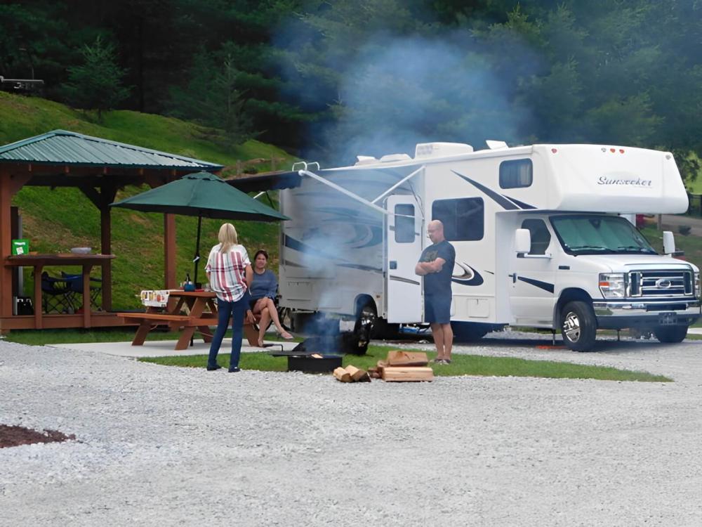 People visiting outside their RV