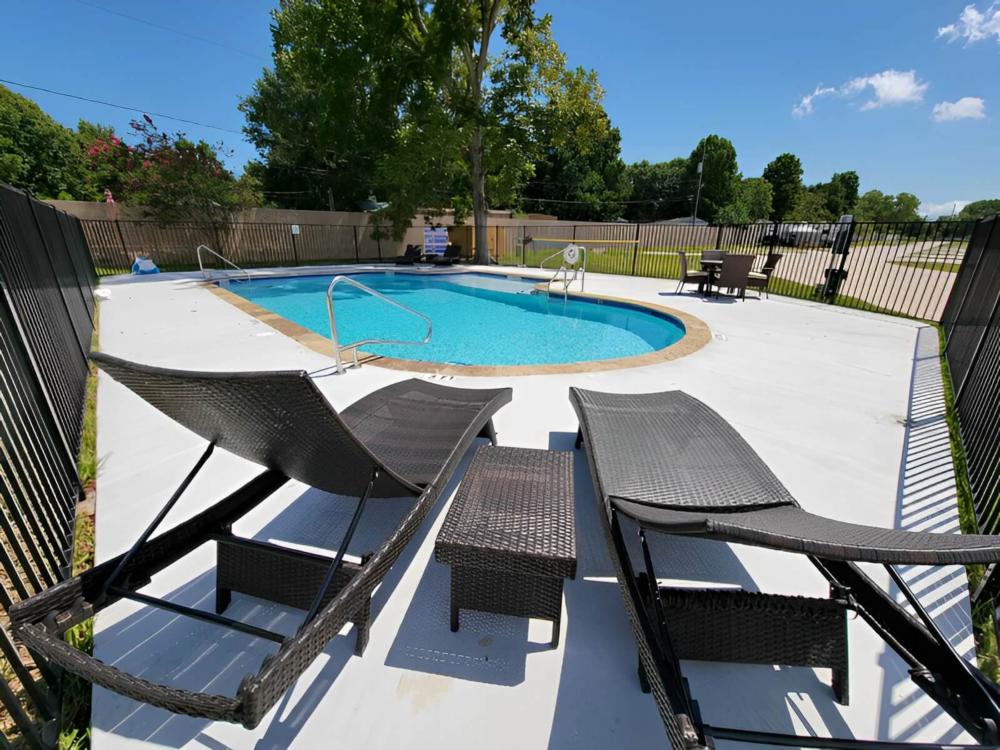 RV with motorcycle parked in front at Jackie's Place RV Resort