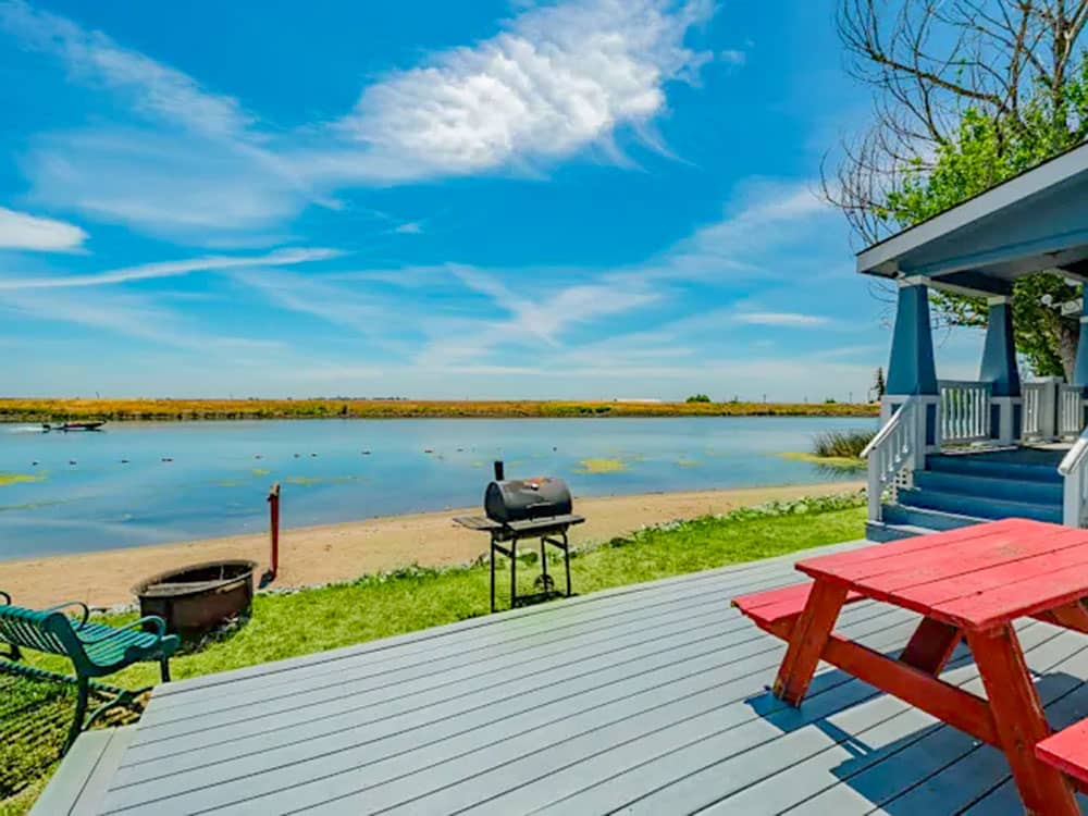 A rental with a fire pit, BBQ and picnic table