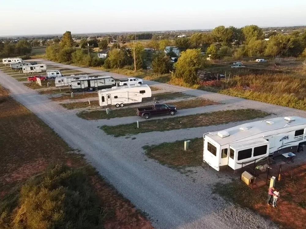 Aerial view of travel trailers parked in RV sites at BEXAR COVE RV PARK