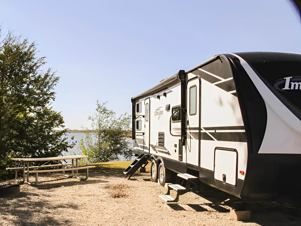 RV site with a picnic table and lake view