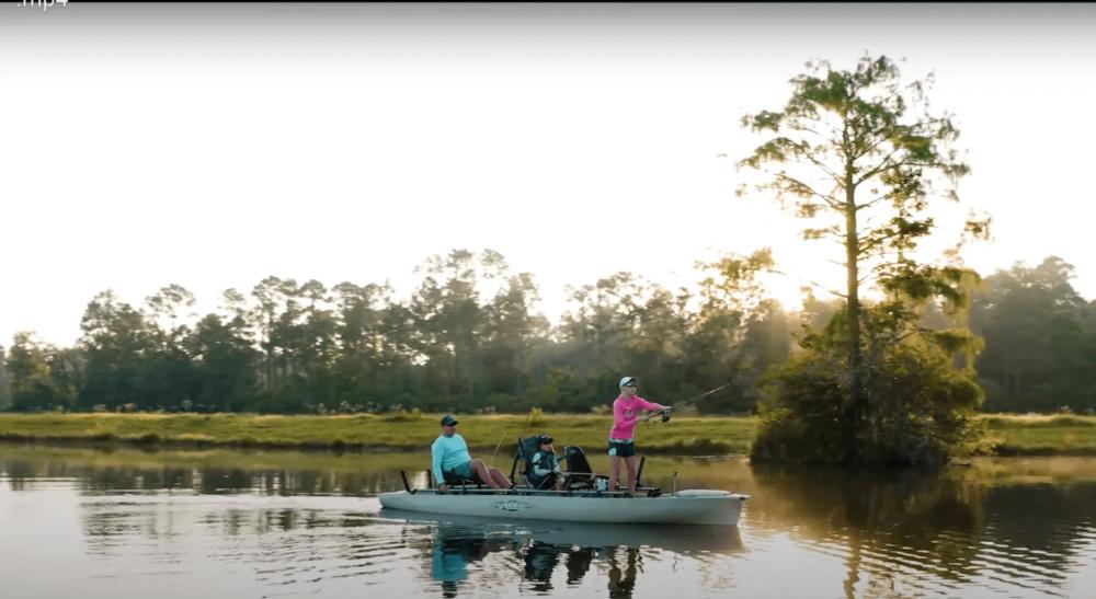 Family fishing in boat at Leisure Lakes RV Resort