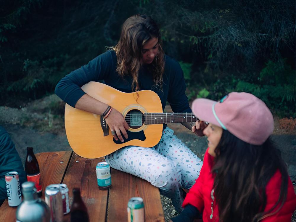 A women playing a guitar