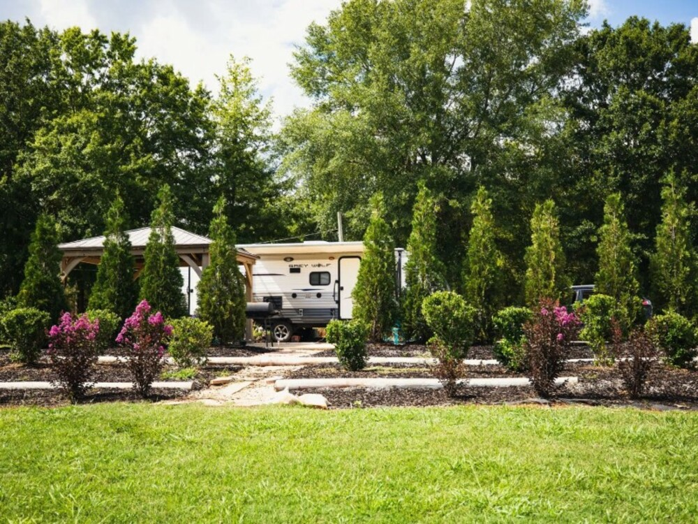 RV Site with trees at Time Away RV Resort