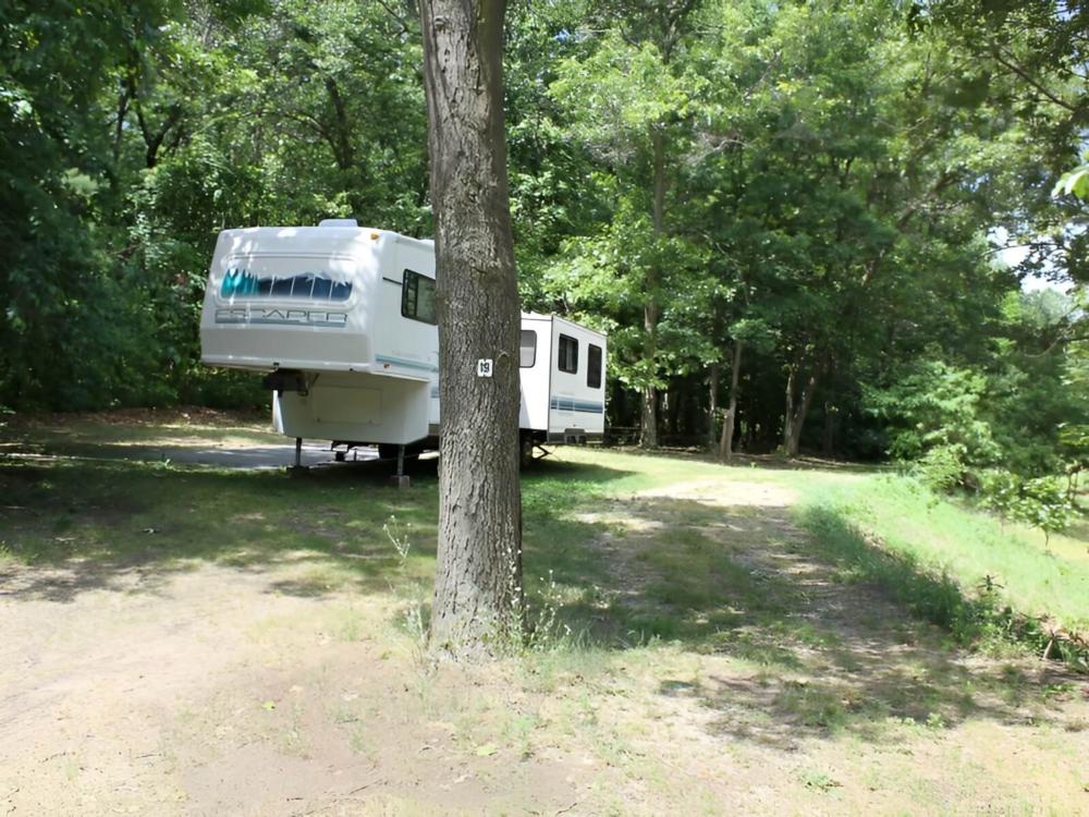 Parked trailer at site Wolf Lake Resort and Campground