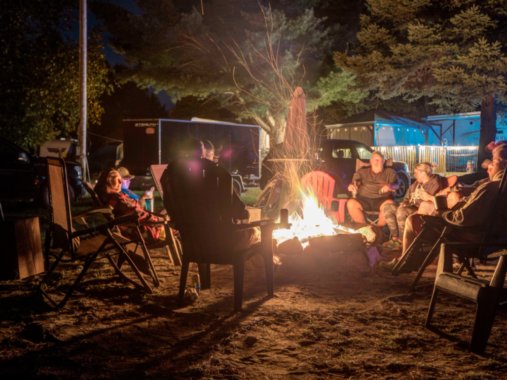 People around at firepit at Tiny Village Parry Sound