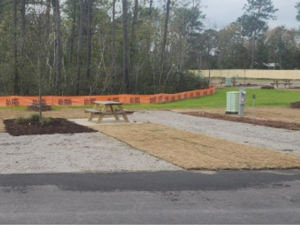 Gravel site with picnic table at Oceans RV Resort