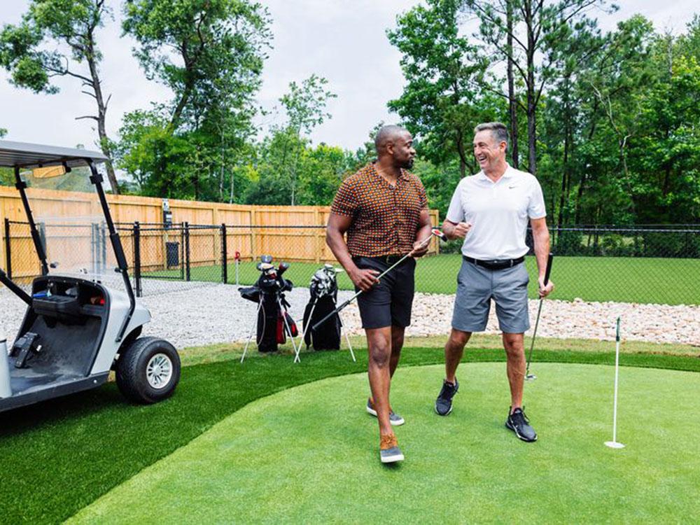 Two men playing golf at OCEANS RV RESORT