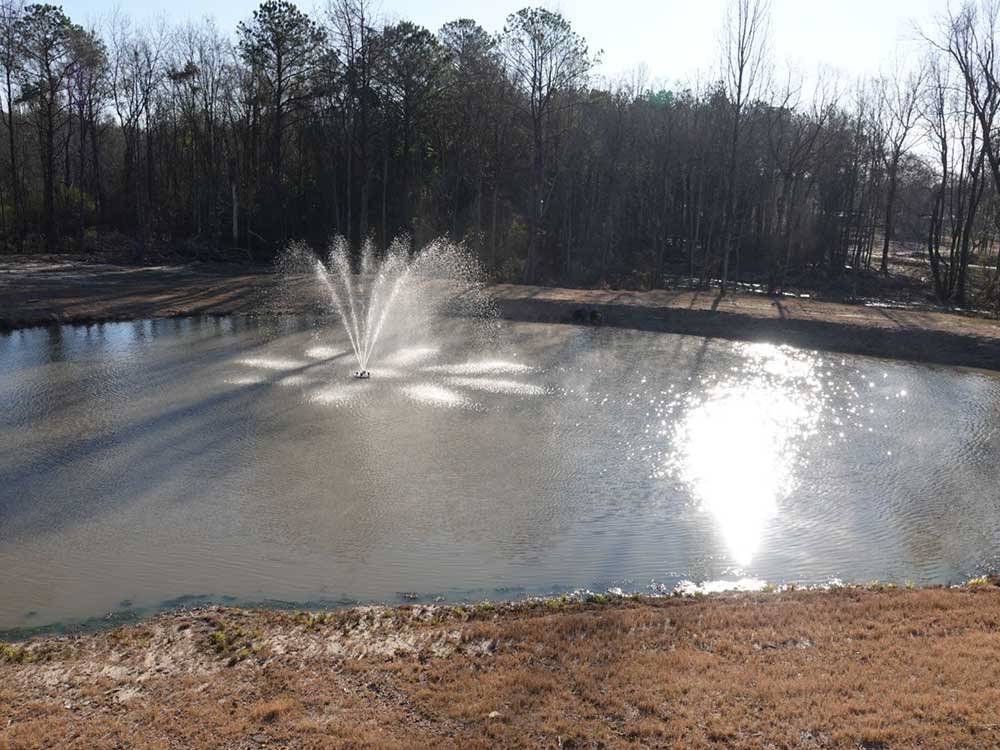 A fountain in the middle of the lake at THORNHILL RIDGE RV COMMUNITY