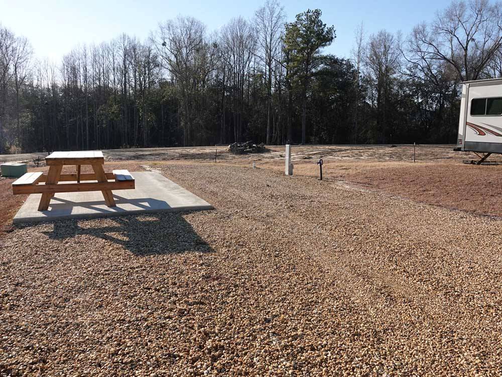 A picnic bench at one of the gravel sites at THORNHILL RIDGE RV COMMUNITY