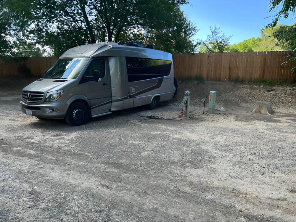 Parked RV at site Riverwood Resort on the Gunnison