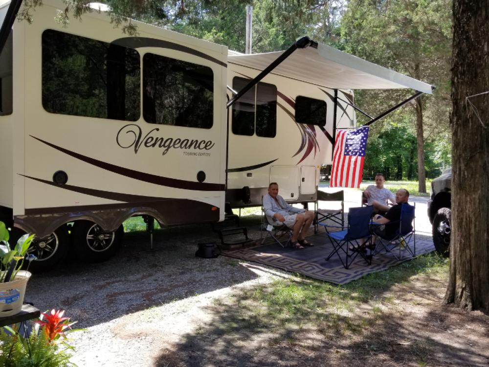 RVers relaxing at site at Country Dream RV Park