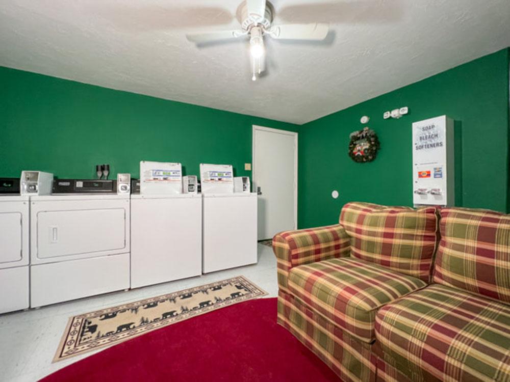 The laundry room with couch at RIVERSHIRE RV RESORT & CAMPING