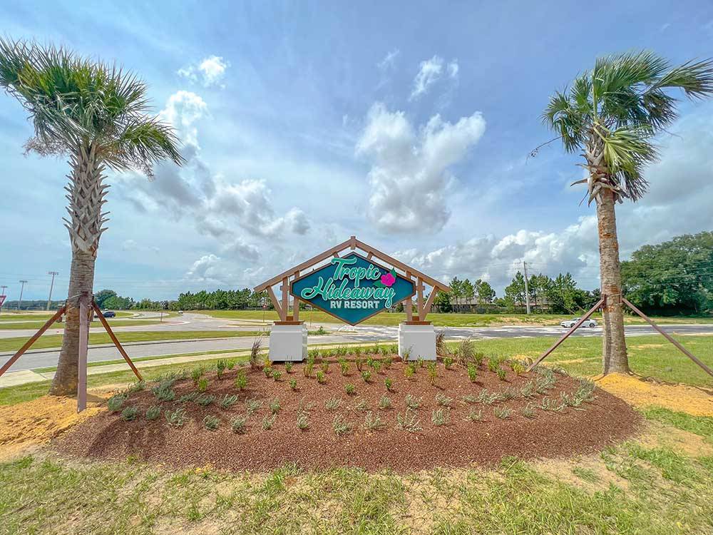 The front entrance sign at TROPIC HIDEAWAY RV RESORT