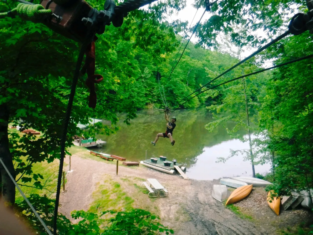 Ziplining over the water at eXplore Brown County