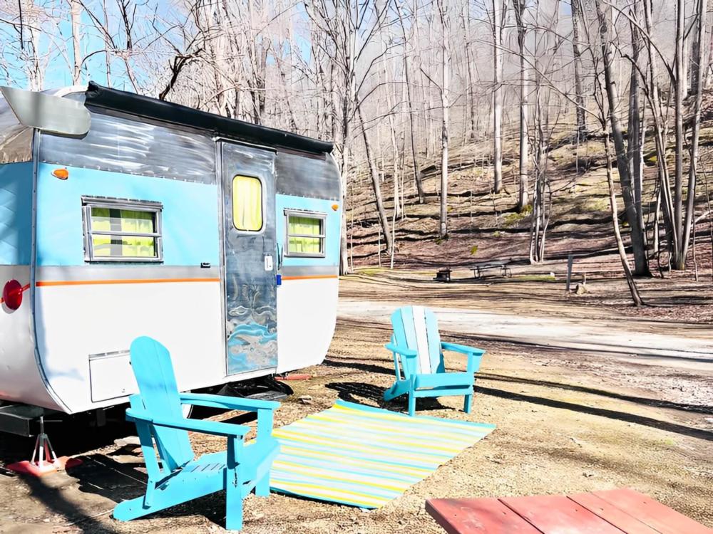 Vintage trailer with colorful chairs