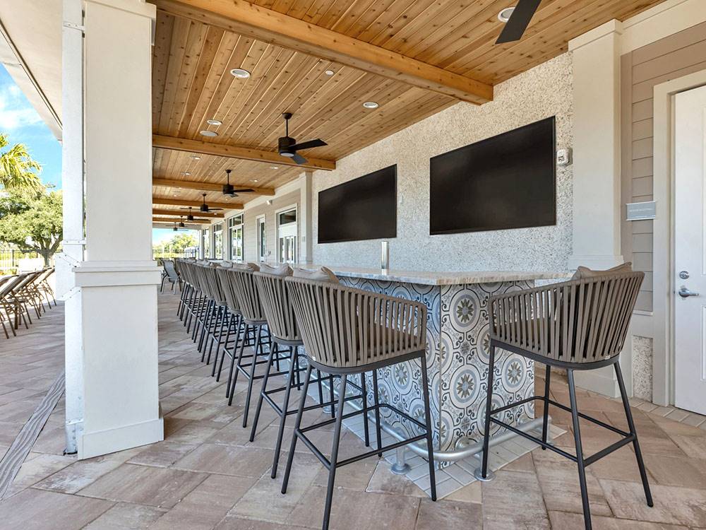 Outdoor bar seating at Southern Sands RV Resort