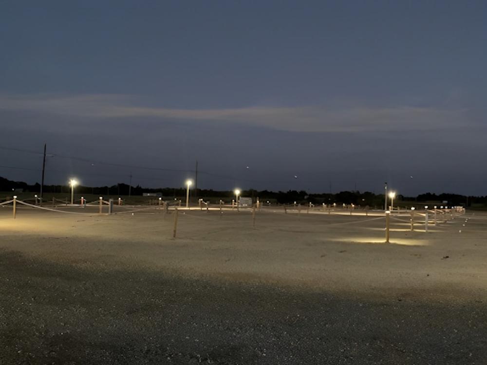 Open RV spaces with night time view at Inn and Out RV Park