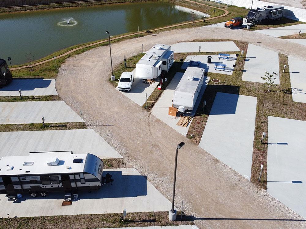 RVs parked in paved sites at NEW CANEY RV PARK