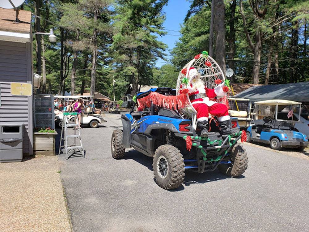 Santa Claus on the back of an ATV