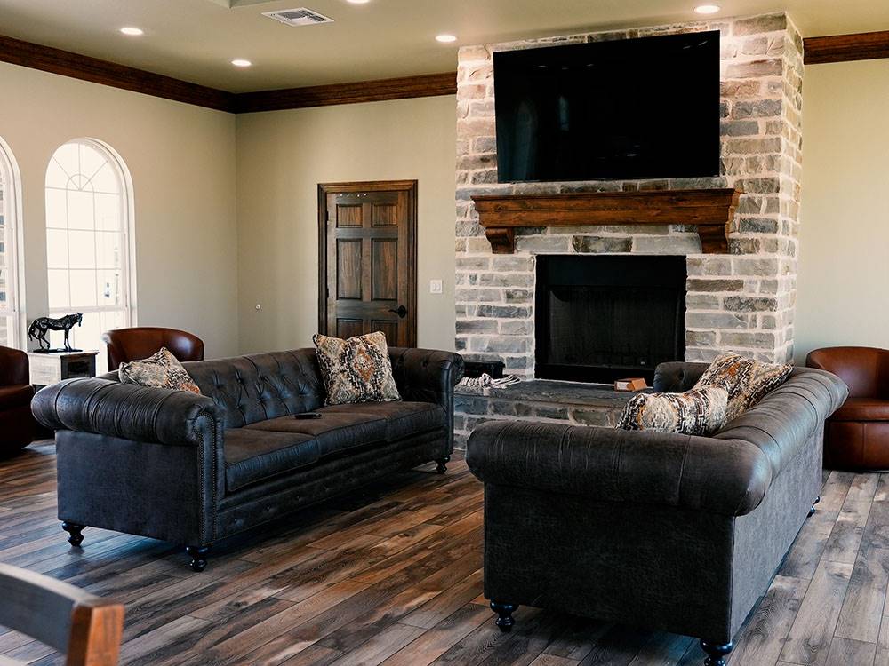 Comfortable seating in the TV area at Crossroads Luxury RV Park