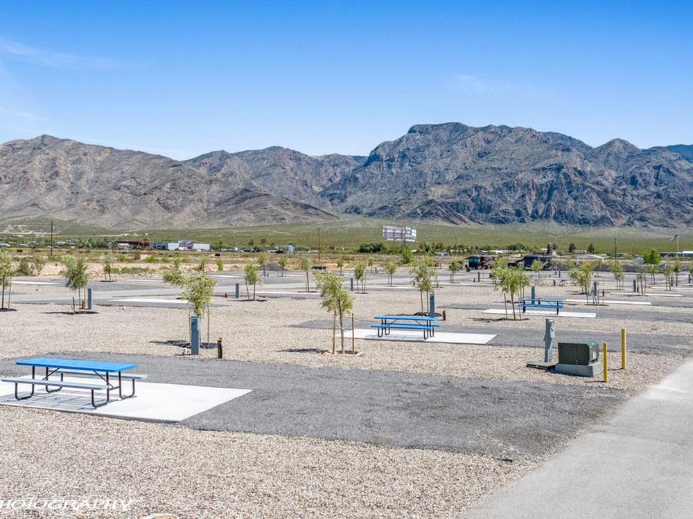 A view of the RV sites with picnic benches at DESERT SPRINGS RV RESORT