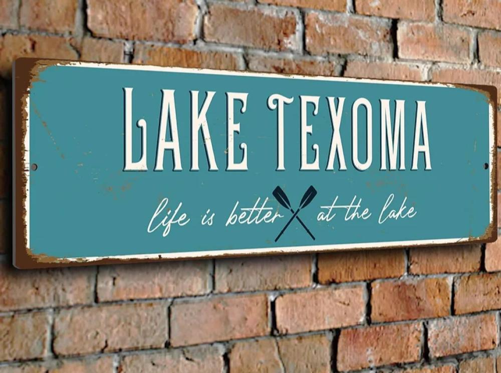 Park sign on a brick wall at Texoma RV Oasis