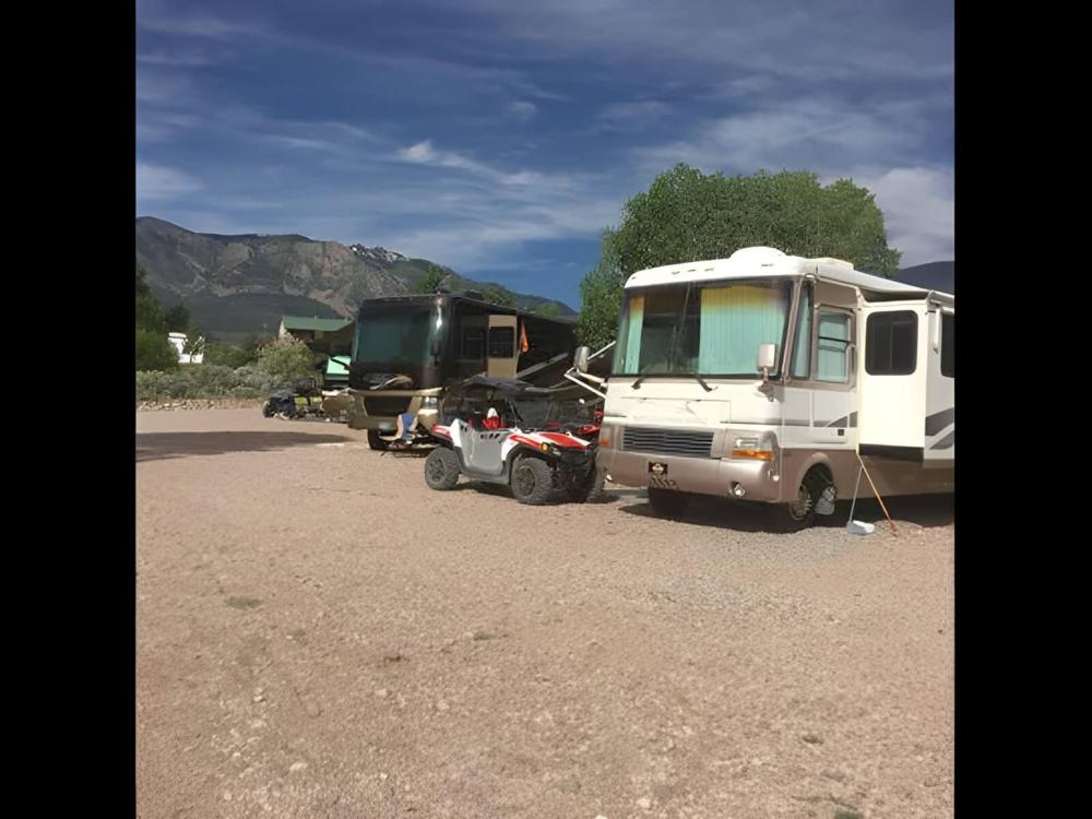 Parked RV's at site Pine Creek Cabins Resort