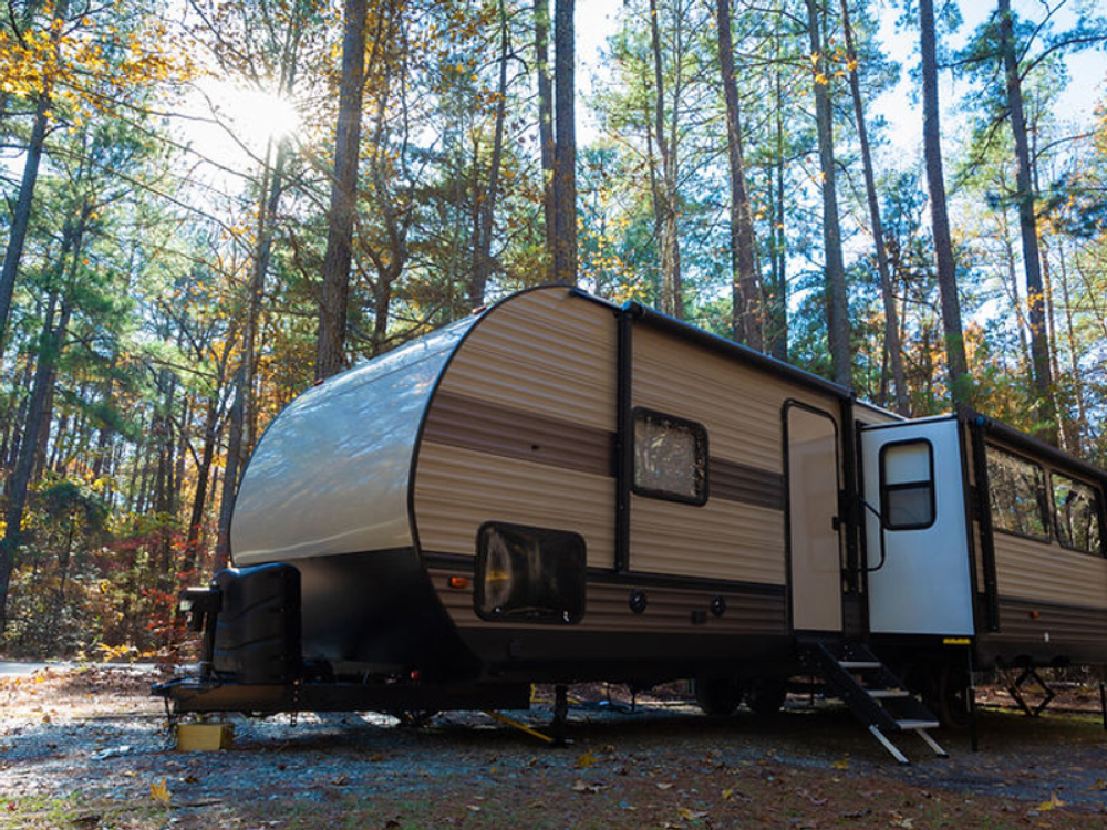 Trailer in a gravel site at Timber Run Campground