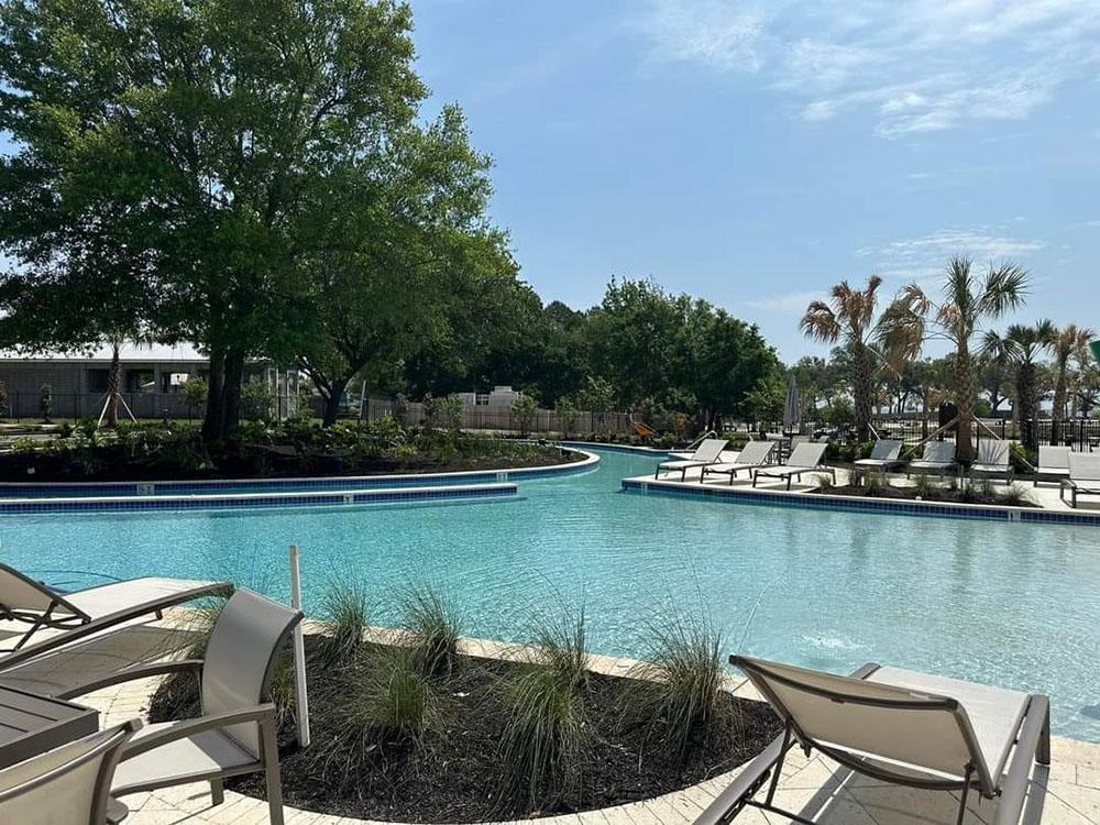 Large pool and seating area at GULFPORT LUXURY RV RESORT