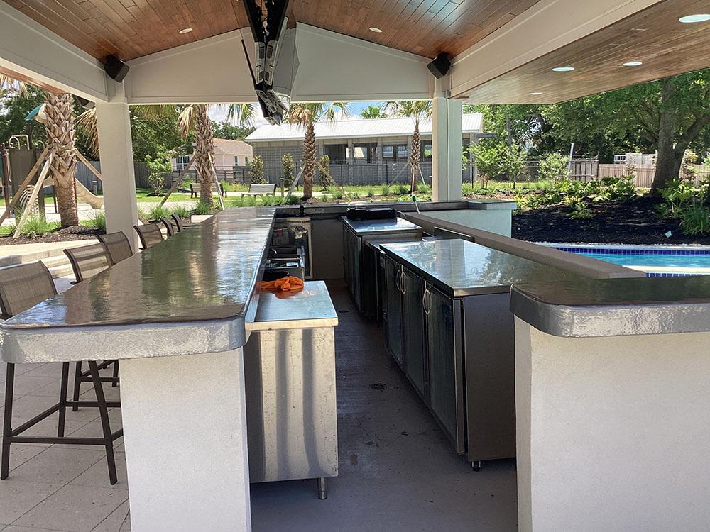 Refreshment area by pool at GULFPORT LUXURY RV RESORT