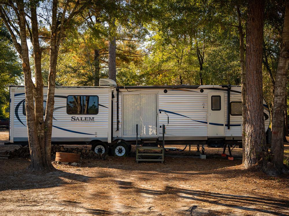A travel trailer parked in a RV site at DOGWOOD RV PARK