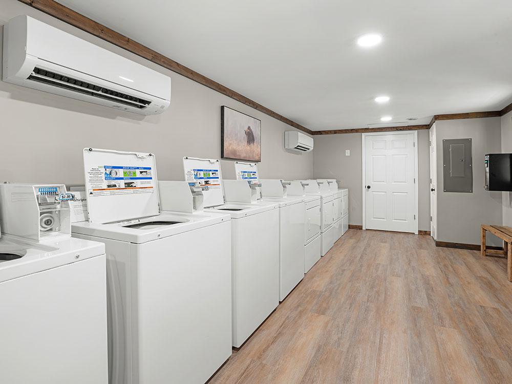 The washers and dryers in the laundry room at SANWAR RV PARK & RESORT