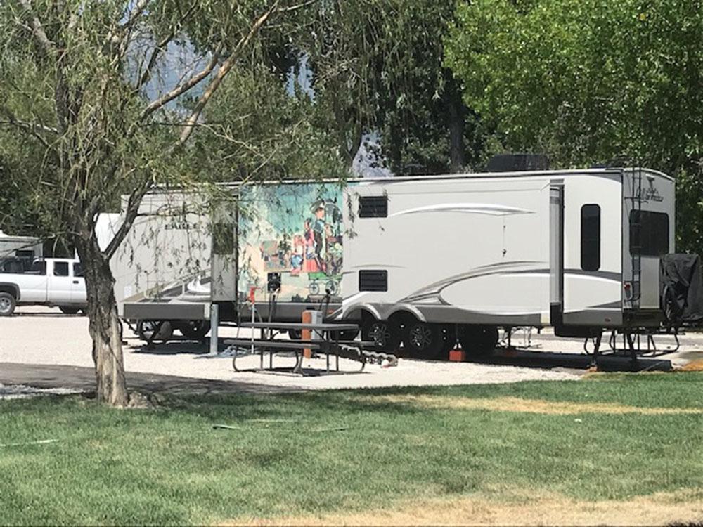 Trailer in RV spot at LAKE SHORE RV PARK