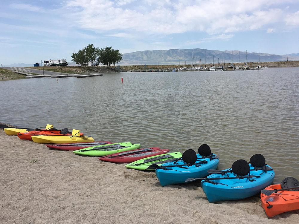 Colorful kayaks on the water at LAKE SHORE RV PARK