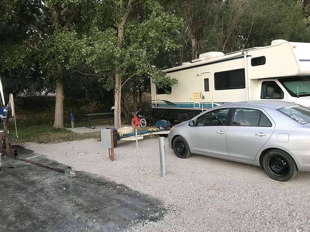 Silver car in camp spot at LAKE SHORE RV PARK