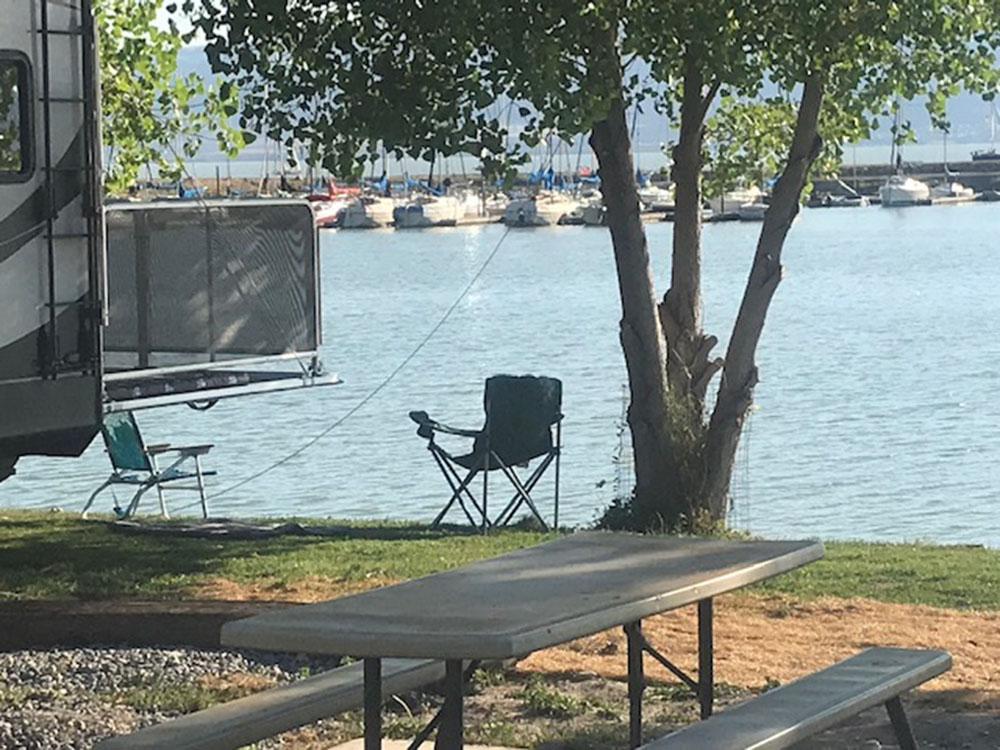 Chair in waterfront site at LAKE SHORE RV PARK