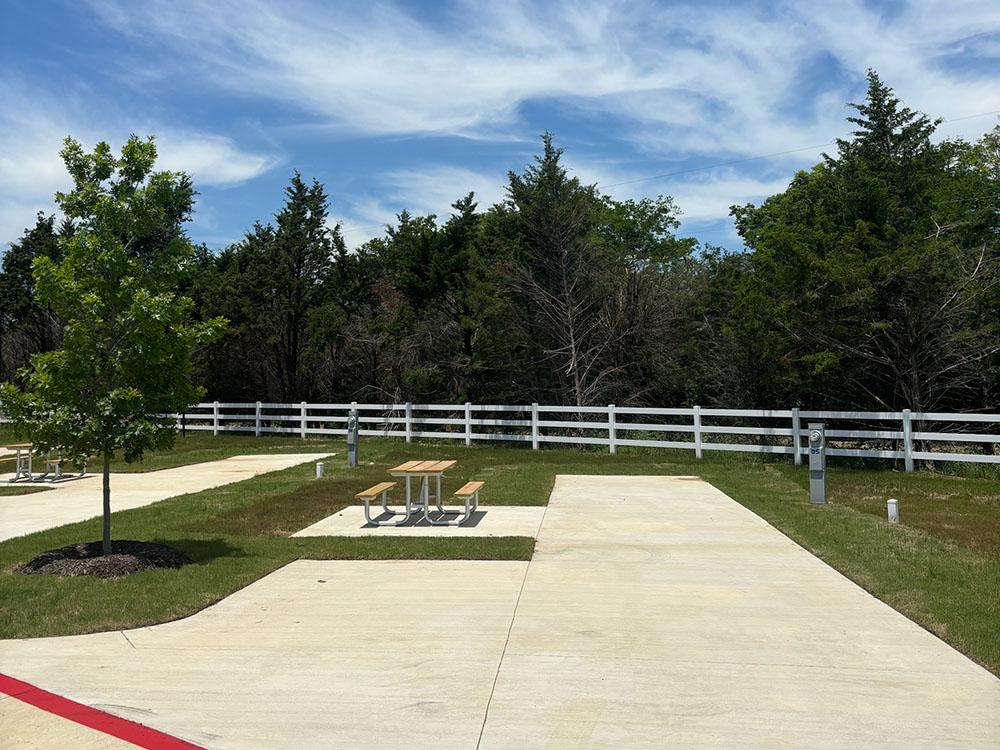 A Now Open sign at the front entrance at CHUCK'S RV RESORT