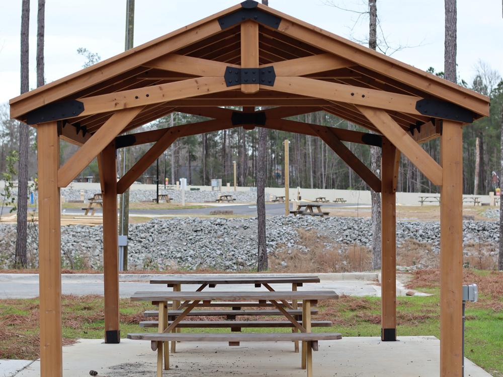 Picnic benches under a gazebo at CROOKED OAKS RV PARK