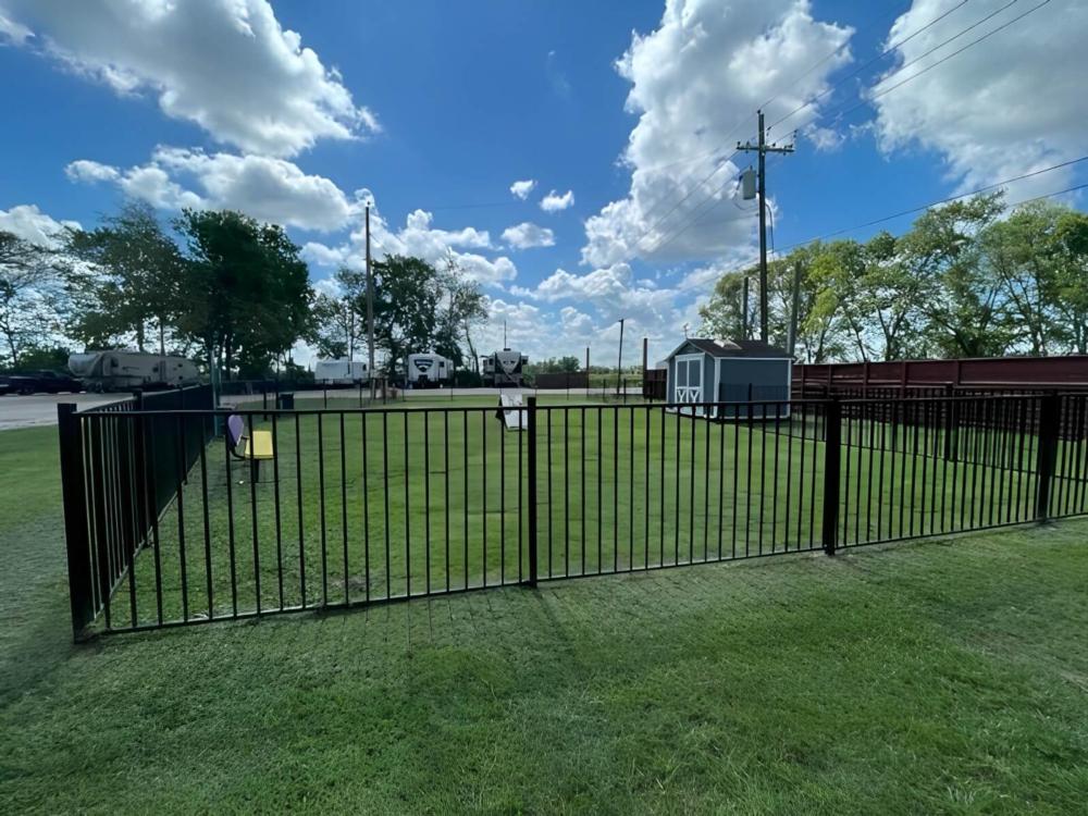 Gated grass area at site Angleton RV Park & Resort
