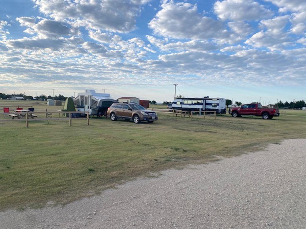 Open grassy RV sites at SILVER WIND RV PARK AND CABINS